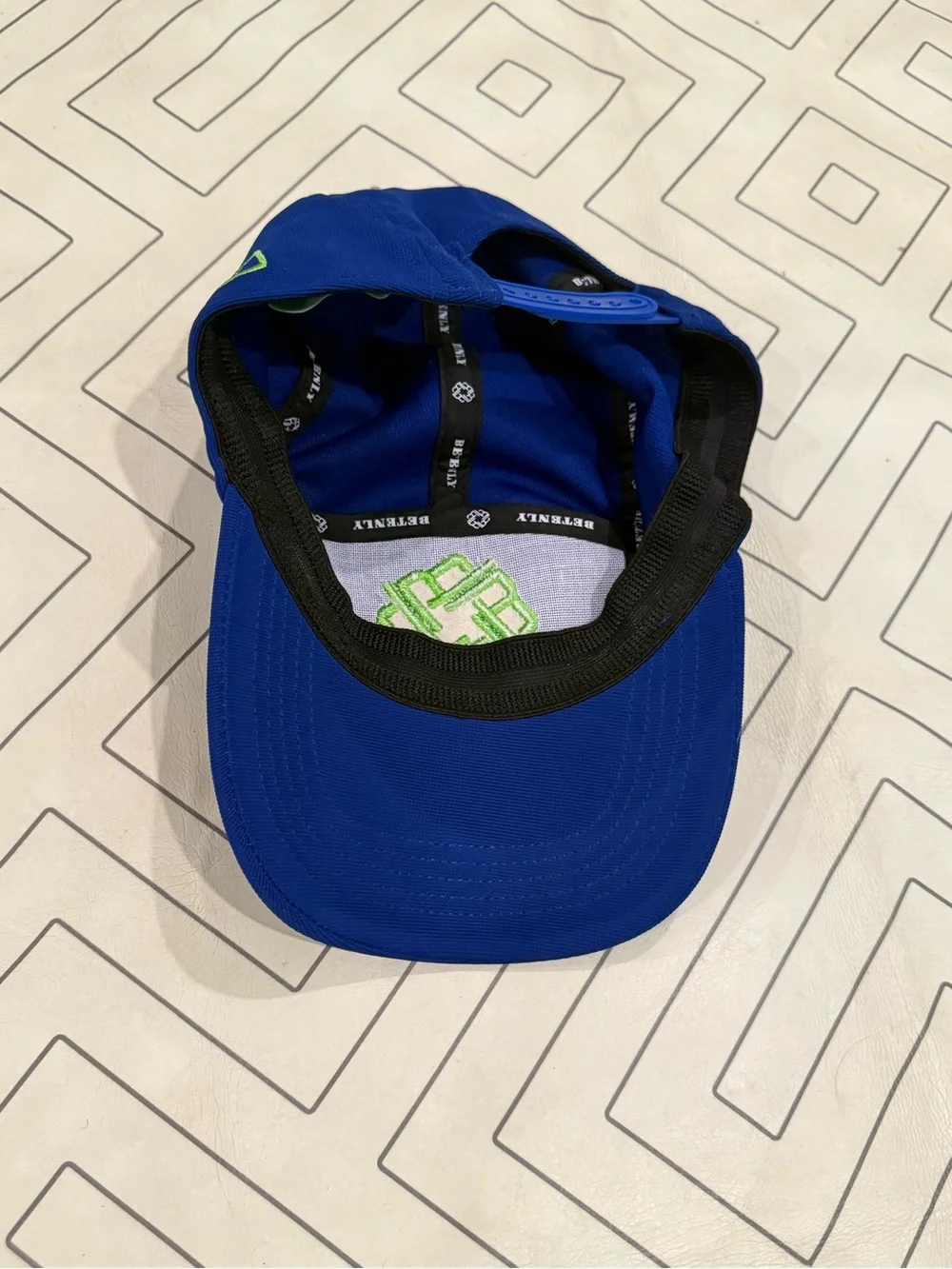 Betenly Blue Athletic Cap with Neon Green Knot Logo
